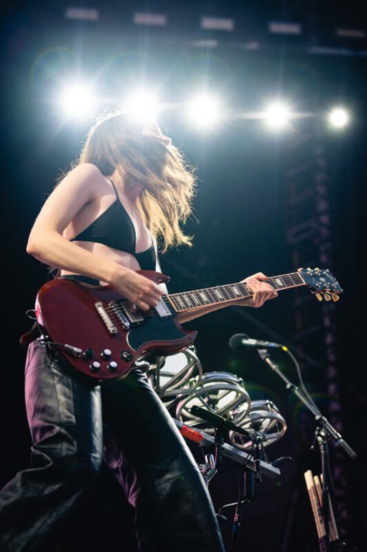 HAIM live in concert in San Diego California, Petco Park. Danielle Haim singing and performing on stage. Professional live music photography by Evan Denworth.