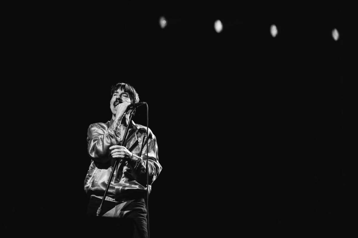 Red Hot Chili Peppers live in concert in San Diego California, Petco Park. Anthony Kiedis singing and performing on stage. Professional live music photography by Evan Denworth.