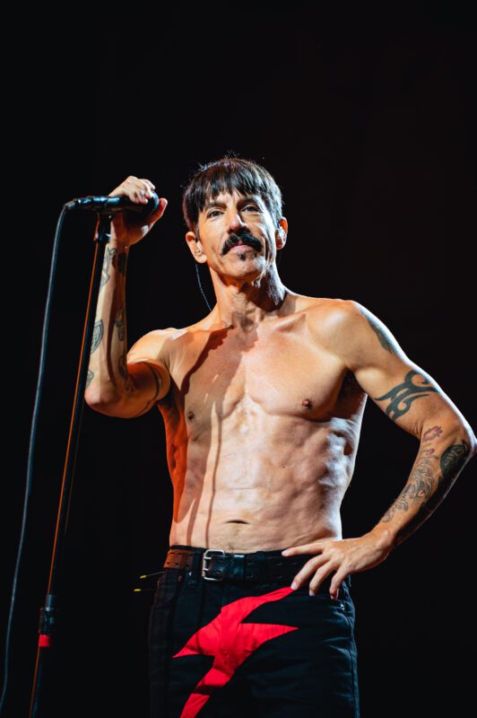 Red Hot Chili Peppers live in concert in San Diego California, Petco Park. Anthony Kiedis singing and performing on stage. Professional live music photography by Evan Denworth.