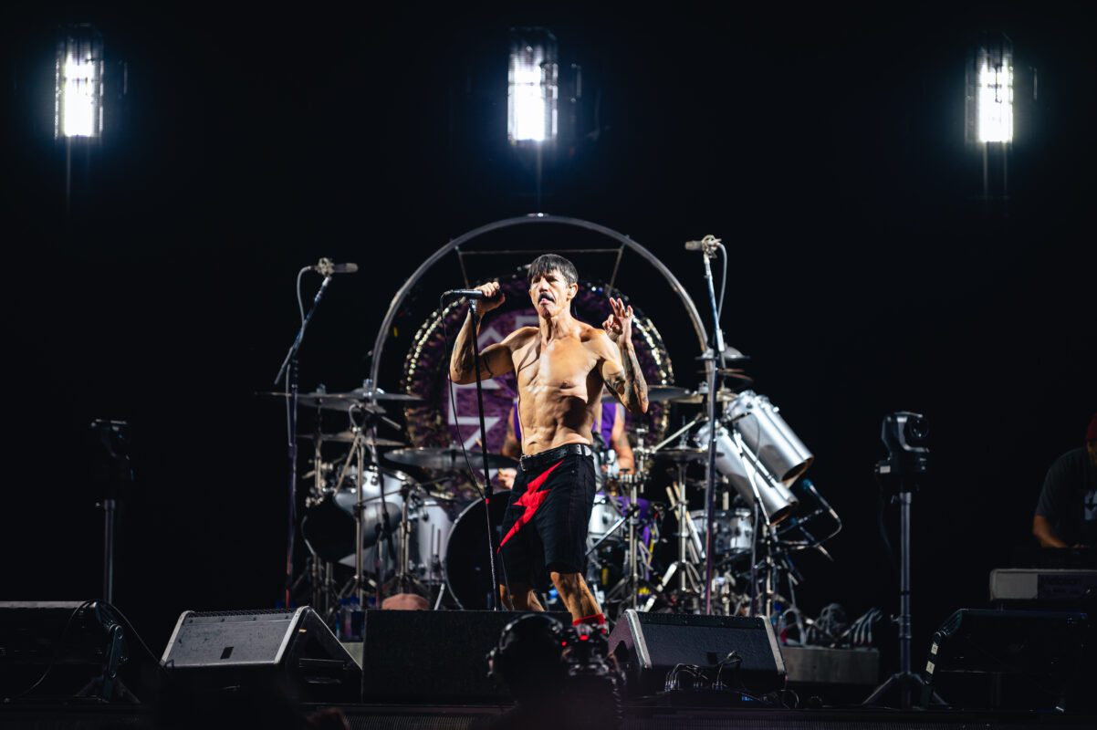Red Hot Chili Peppers live in concert in San Diego California, Petco Park. Anthony Kiedis singing and performing on stage. Professional live music photography by Evan Denworth.