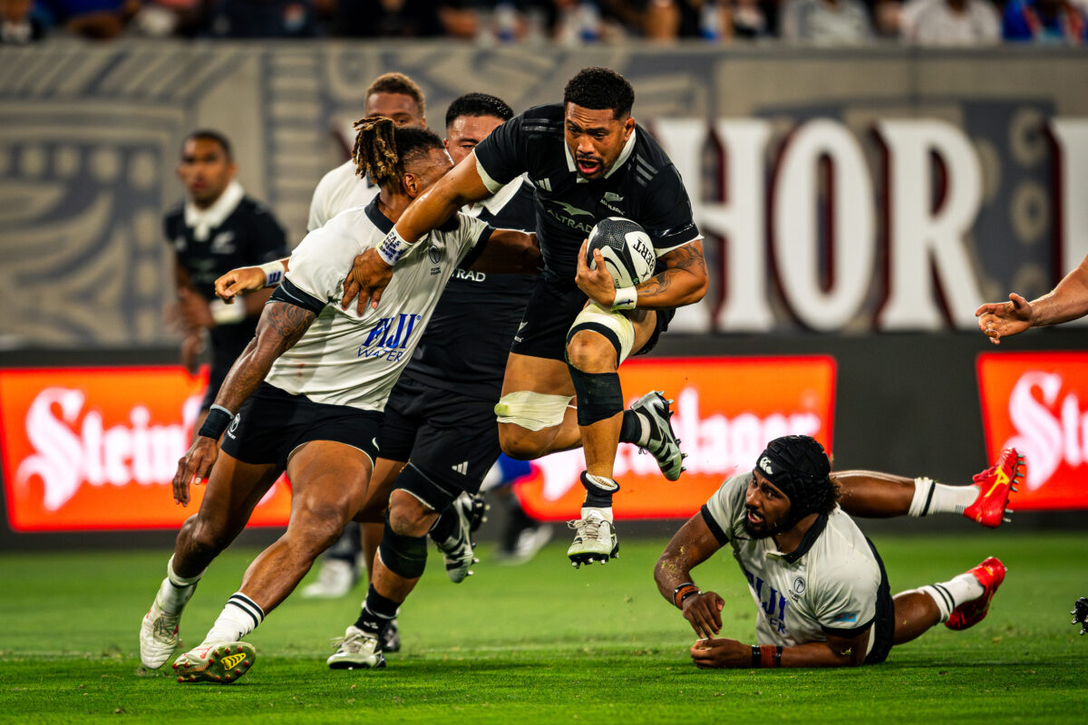New Zealand All Blacks Ardie Savea playing against Fiji Rugby at Snapdragon Stadium in San Diego California. Professional sports action photography. High-impact commercial sports imaging for team branding.