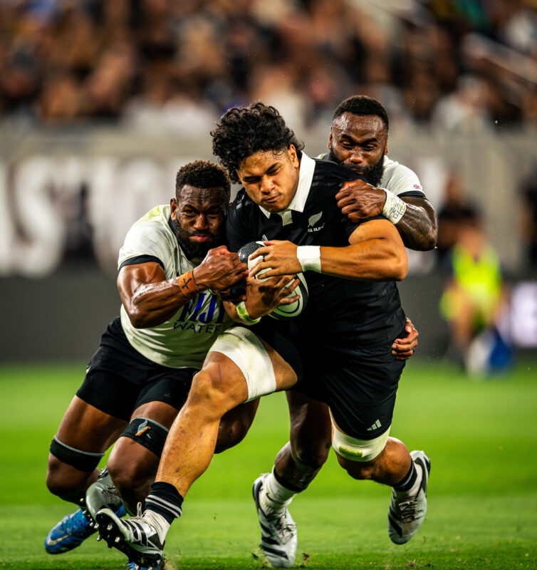 New Zealand All Blacks Wallace Sititi playing against Fiji Rugby at Snapdragon Stadium in San Diego California. Professional sports action photography. High-impact commercial sports imaging for team branding.