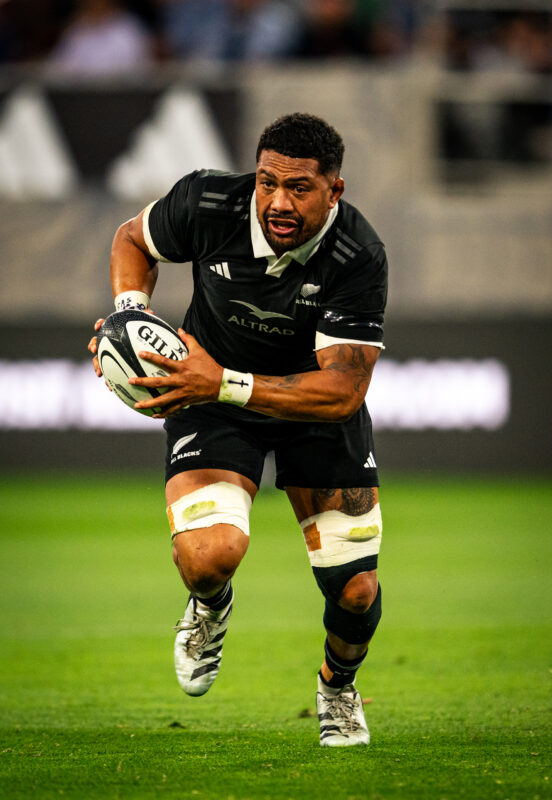 New Zealand All Blacks Ardie Savea playing against Fiji Rugby at Snapdragon Stadium in San Diego California. Professional sports action photography. High-impact commercial sports imaging for team branding.